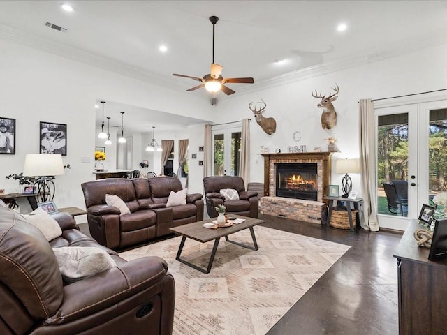 living room featuring french doors, plenty of natural light, crown molding, and ceiling fan