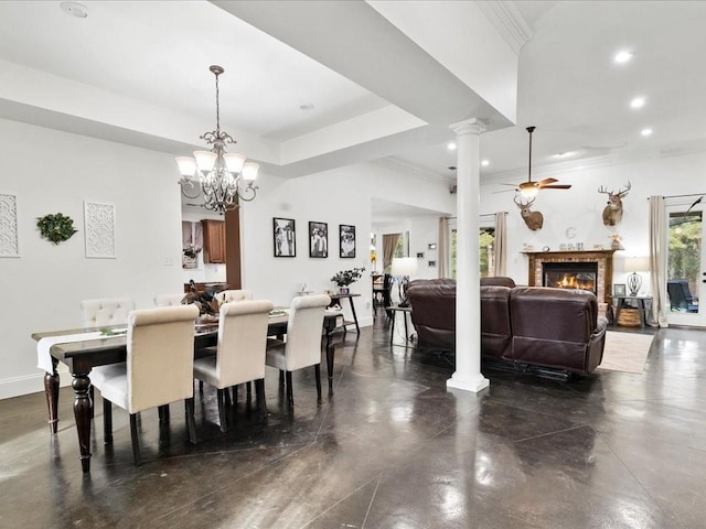 dining area featuring decorative columns, ceiling fan with notable chandelier, and ornamental molding