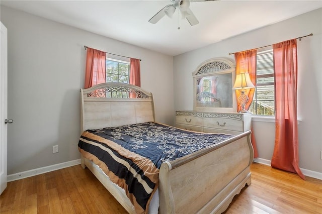 bedroom featuring light hardwood / wood-style flooring and ceiling fan