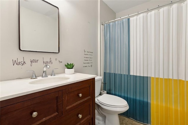 bathroom featuring tile patterned flooring, vanity, toilet, and walk in shower