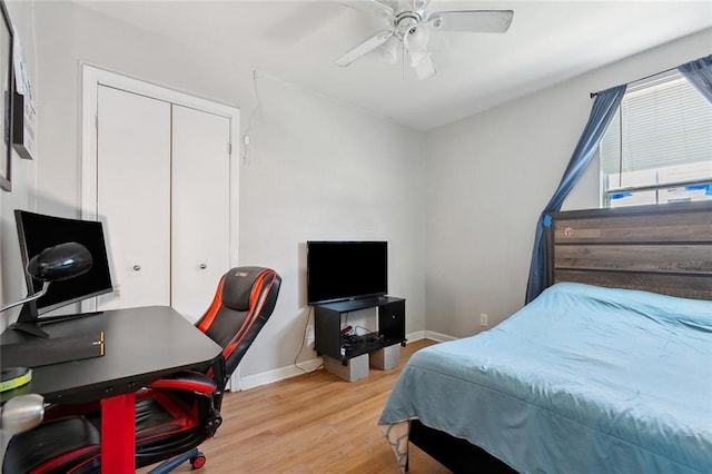 bedroom with wood-type flooring, a closet, and ceiling fan