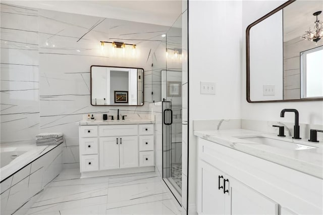 bathroom featuring vanity and separate shower and tub