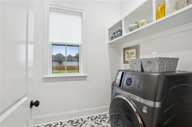 washroom with washer / clothes dryer