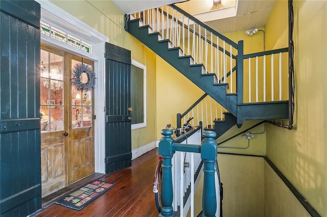 entrance foyer with dark hardwood / wood-style floors and french doors