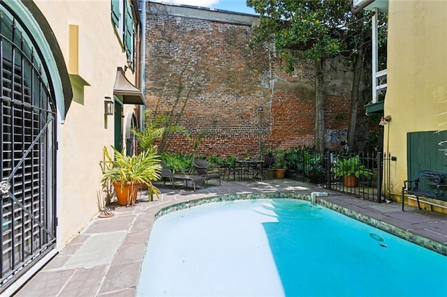 view of pool featuring a patio area