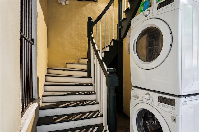 laundry room featuring stacked washing maching and dryer