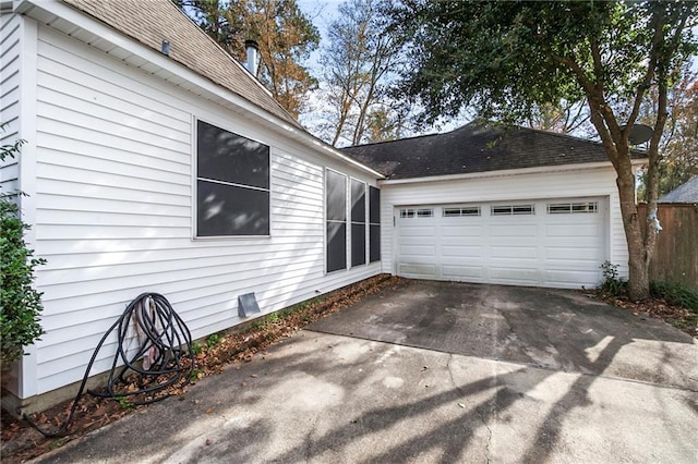 view of side of property with a garage