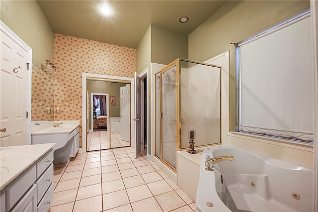 bathroom with tile patterned floors, vanity, and plus walk in shower