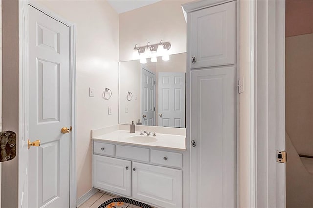 bathroom with tile patterned floors and vanity