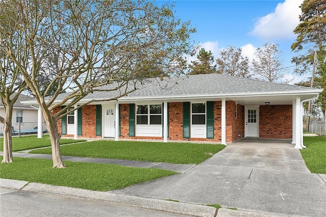 2104 Edgar Dr, Violet, LA 70092 - single story home with driveway, a carport, brick siding, and roof with shingles