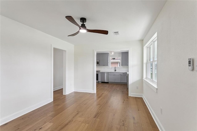 2104 Edgar Dr, Violet, LA 70092 - unfurnished living room featuring ceiling fan and wood finished floors