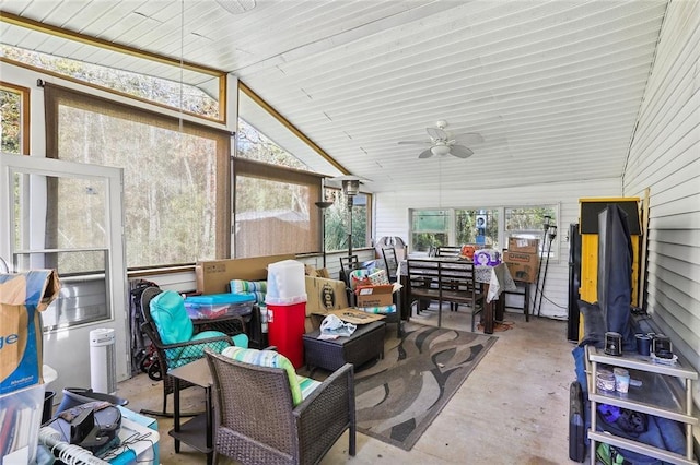 sunroom / solarium featuring ceiling fan, lofted ceiling, and wooden ceiling