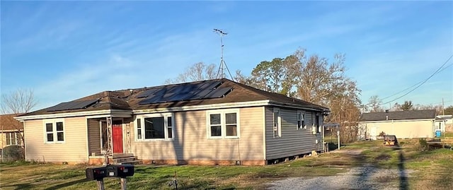 view of front of home with solar panels