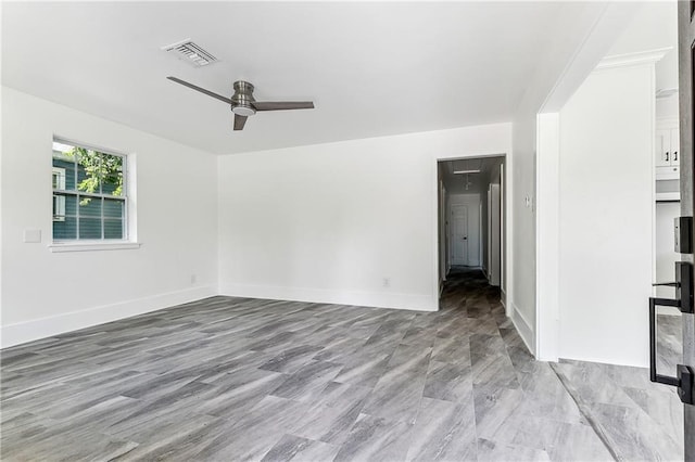 8014 Lucerne St, New Orleans, LA 70128 - unfurnished living room featuring ceiling fan, baseboards, and attic access