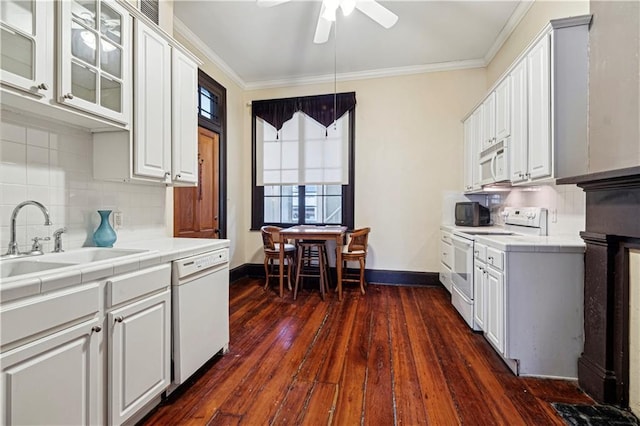 kitchen with ceiling fan, sink, dark hardwood / wood-style flooring, white appliances, and white cabinets