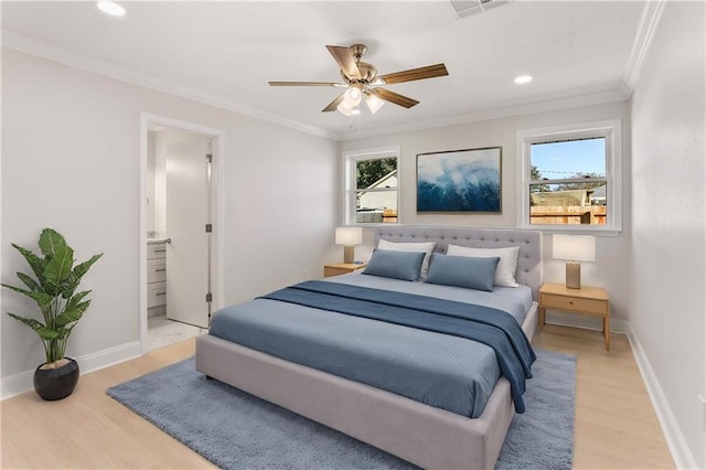 bedroom with ensuite bath, ceiling fan, crown molding, and light hardwood / wood-style floors