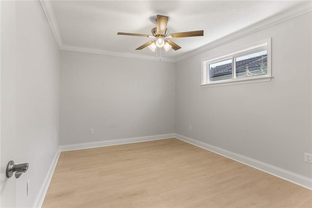 spare room with light hardwood / wood-style flooring and crown molding