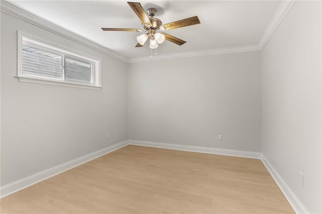 empty room with ceiling fan, light hardwood / wood-style floors, and crown molding