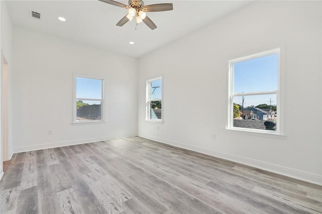 unfurnished room featuring light hardwood / wood-style flooring and ceiling fan