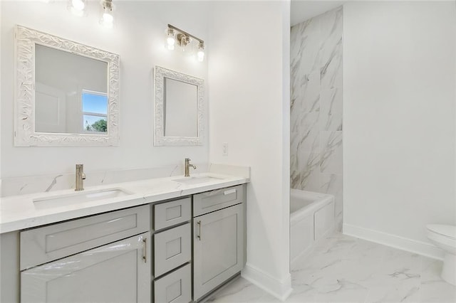 full bathroom featuring tiled shower / bath, vanity, and toilet