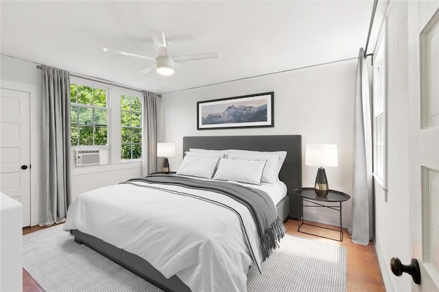 bedroom featuring ceiling fan and wood finished floors