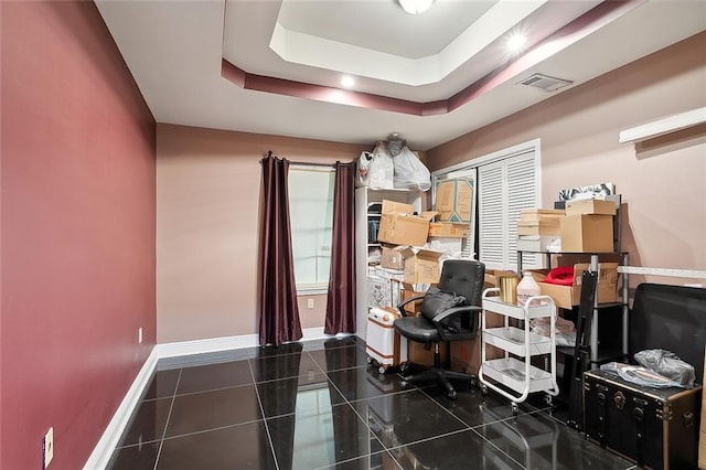 home office with a tray ceiling