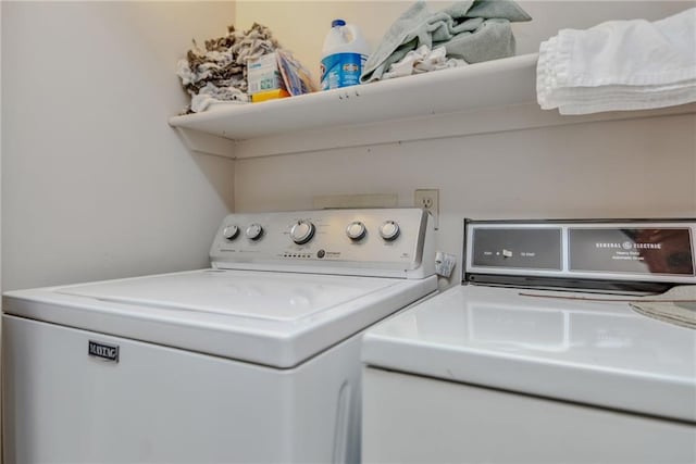 laundry area featuring washing machine and clothes dryer