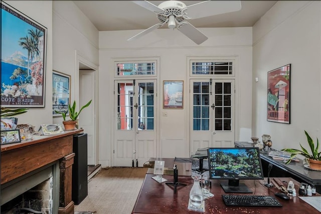 sitting room featuring french doors and ceiling fan