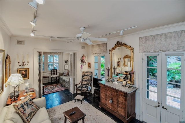 625 Dumaine St, New Orleans, LA 70116 - living room featuring track lighting, french doors, crown molding, a ceiling fan, and dark tile patterned floors