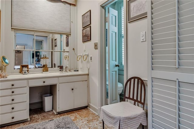 bathroom with vanity and toilet