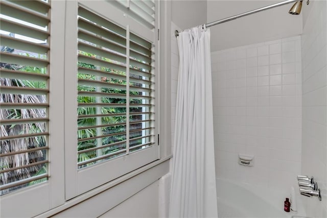 interior space with shower / bath combo with shower curtain