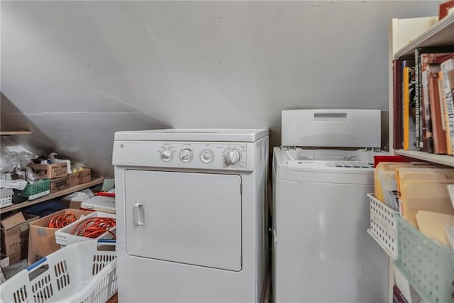 clothes washing area featuring separate washer and dryer