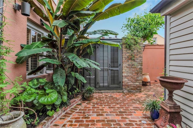 625 Dumaine St, New Orleans, LA 70116 - doorway to property featuring a patio area