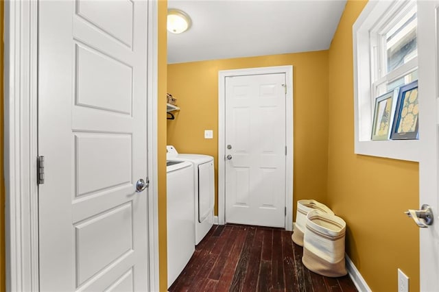 clothes washing area with dark wood-type flooring and washer and dryer