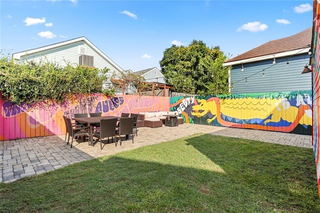 view of yard with a patio area and outdoor lounge area