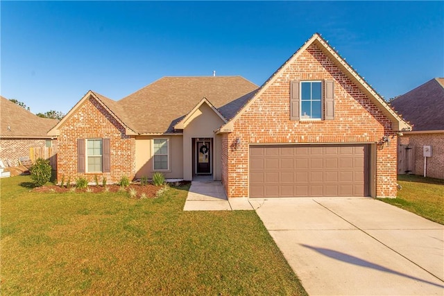 view of front of property with a garage and a front yard