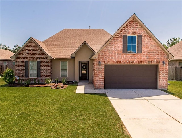 20291 Clemson Way, Ponchatoula, LA 70454 - traditional home with brick siding, driveway, a garage, and roof with shingles