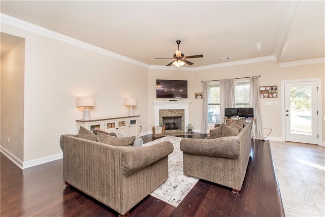 living room featuring ceiling fan, dark hardwood / wood-style flooring, and crown molding