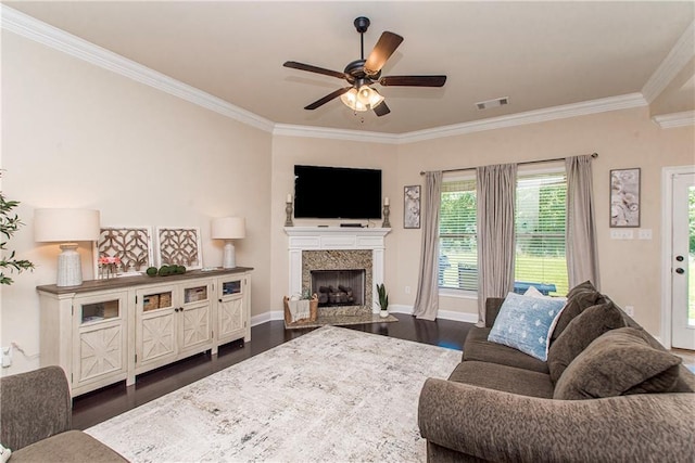 20291 Clemson Way, Ponchatoula, LA 70454 - living area featuring crown molding, dark wood-style floors, ceiling fan, a fireplace with flush hearth, and baseboards