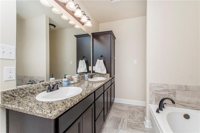 bathroom with vanity and a tub to relax in