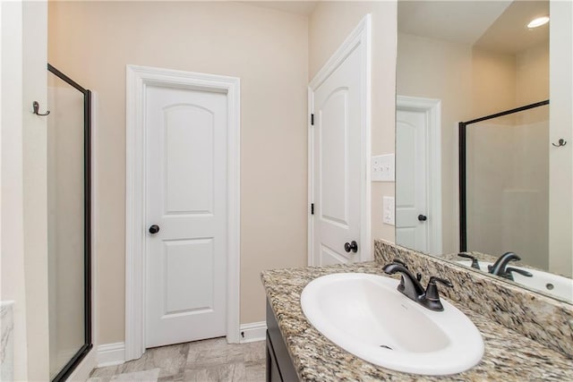 20291 Clemson Way, Ponchatoula, LA 70454 - full bathroom with a shower stall, vanity, and baseboards
