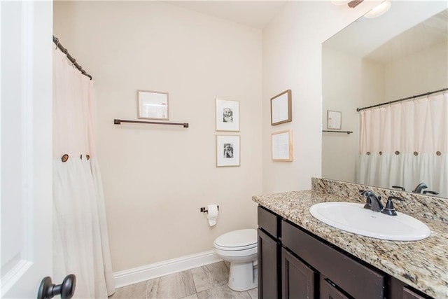20291 Clemson Way, Ponchatoula, LA 70454 - bathroom with vanity, toilet, baseboards, and curtained shower