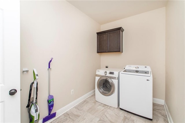 20291 Clemson Way, Ponchatoula, LA 70454 - laundry room with washer and dryer, cabinet space, baseboards, and light marble finish floors