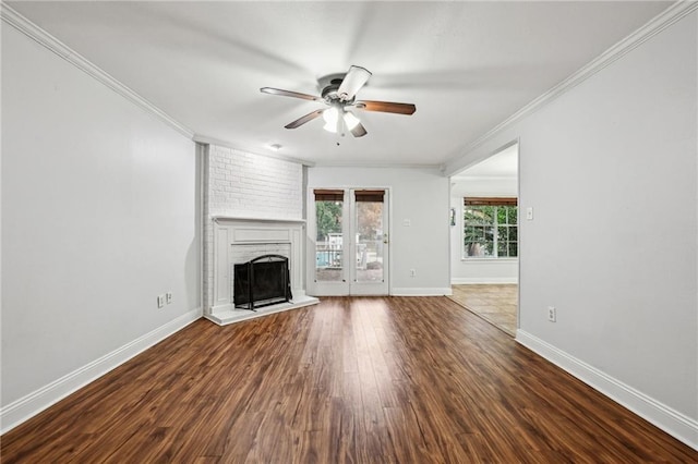 unfurnished living room featuring a fireplace, hardwood / wood-style flooring, ceiling fan, and ornamental molding