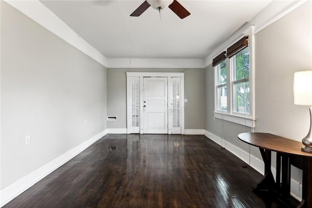 entrance foyer featuring ceiling fan and dark wood-type flooring