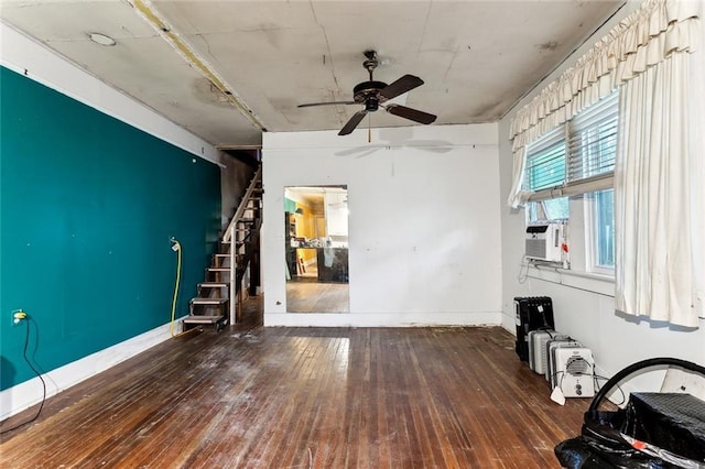 unfurnished living room with ceiling fan, dark hardwood / wood-style flooring, and cooling unit