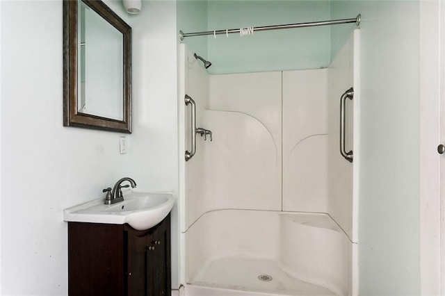 bathroom with a shower and vanity