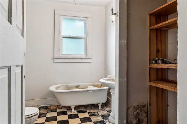 bathroom featuring a bathing tub and toilet