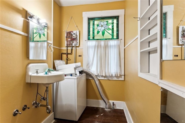 laundry room featuring washer / dryer and dark wood-type flooring