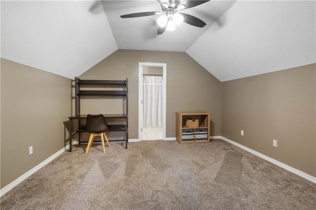 additional living space featuring ceiling fan, lofted ceiling, and carpet floors